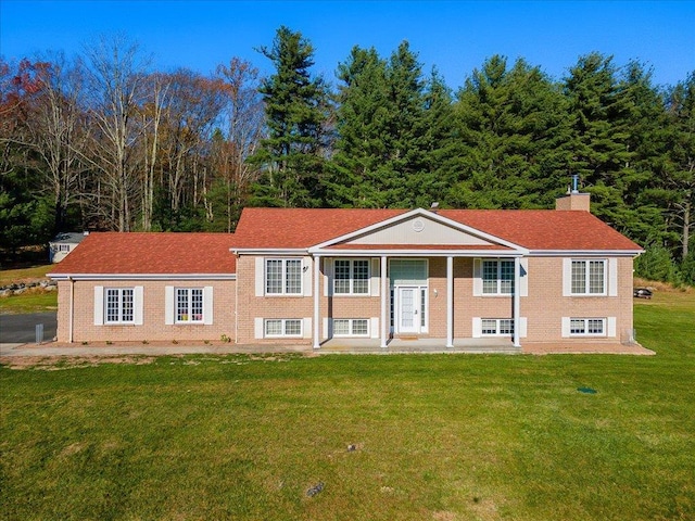 236 Budd Rd, Wurtsboro, NY 12788 - raised ranch featuring a front lawn and a chimney