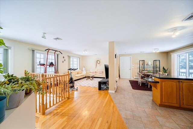 236 Budd Rd, Wurtsboro, NY 12788 - living area with healthy amount of natural light, light stone finish floors, and baseboards