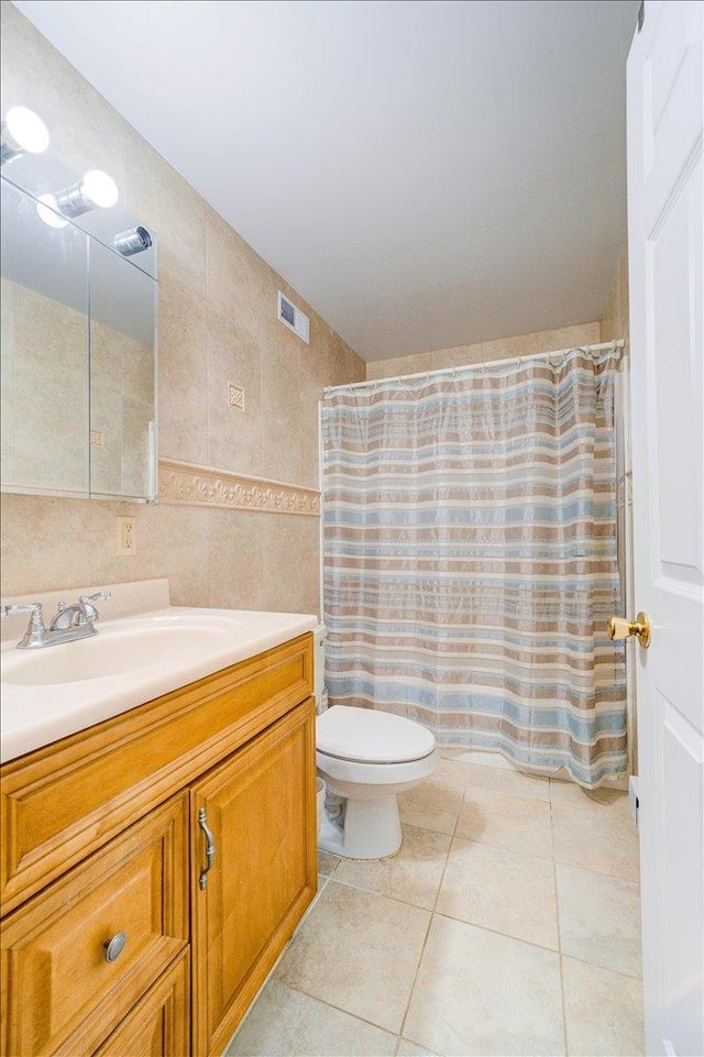 236 Budd Rd, Wurtsboro, NY 12788 - bathroom with tile walls, vanity, toilet, tile patterned flooring, and curtained shower