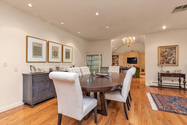 1314 Everit Pl, Hewlett Harbor, NY 11557 - dining area featuring a chandelier, light wood-style flooring, baseboard heating, recessed lighting, and baseboards