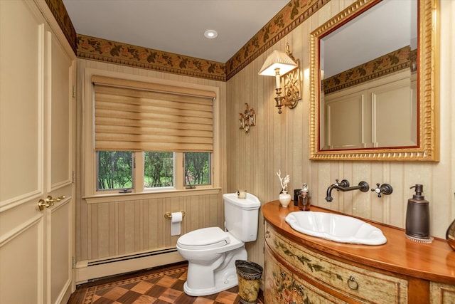 1314 Everit Pl, Hewlett Harbor, NY 11557 - half bathroom with a baseboard heating unit, baseboards, vanity, toilet, and recessed lighting