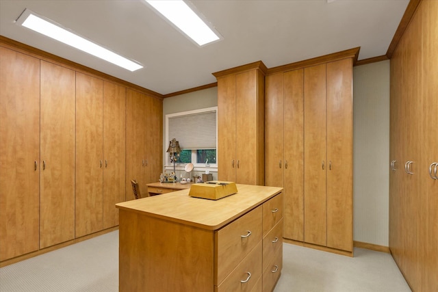 1314 Everit Pl, Hewlett Harbor, NY 11557 - kitchen featuring ornamental molding, light countertops, brown cabinetry, and light colored carpet