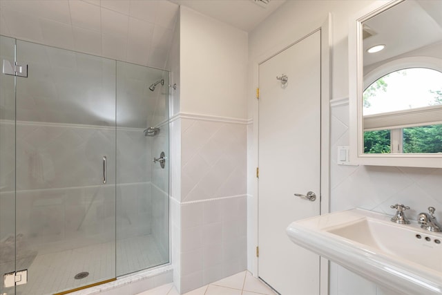 1314 Everit Pl, Hewlett Harbor, NY 11557 - bathroom with tile walls, a shower stall, and a sink