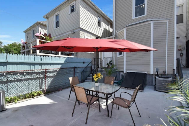view of patio / terrace with central air condition unit and outdoor dining area