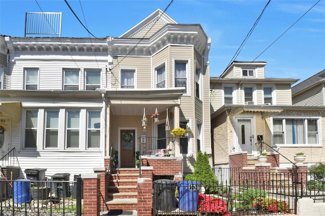 multi unit property with entry steps and a fenced front yard