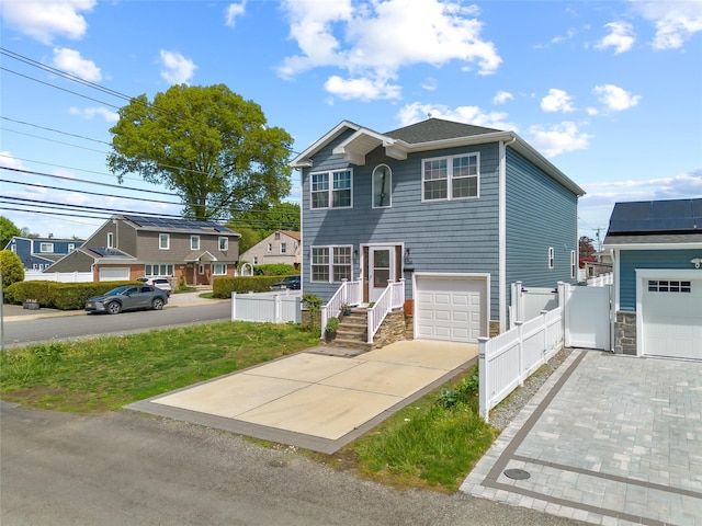 3875 S St, Seaford, NY 11783 - view of front facade featuring fence and concrete driveway