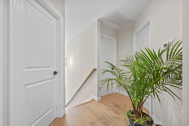 3875 S St, Seaford, NY 11783 - hall featuring an upstairs landing, light wood-style flooring, and baseboards