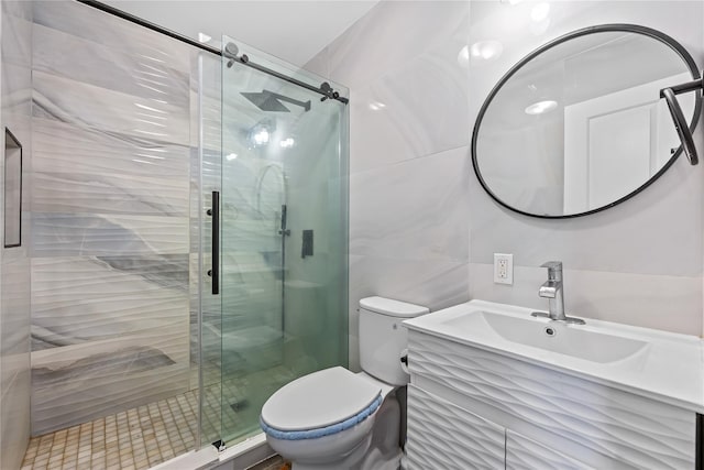 3875 S St, Seaford, NY 11783 - full bathroom with tile walls, toilet, a stall shower, and vanity