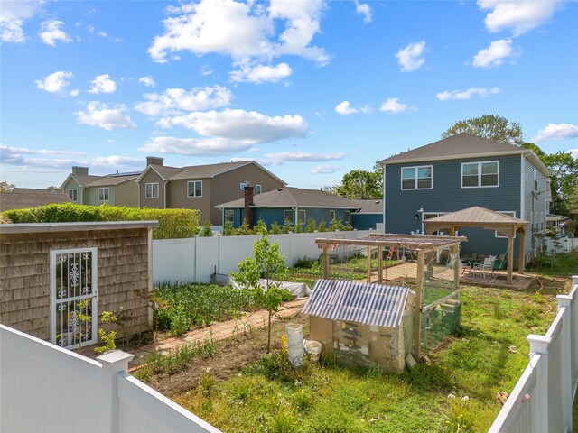 3875 S St, Seaford, NY 11783 - fenced backyard with an outbuilding and a residential view