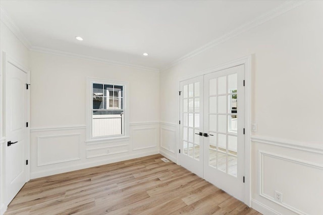 42 Second St, Extension, Glen Cove, NY 11542 - entryway with french doors, light wood finished floors, crown molding, a decorative wall, and recessed lighting