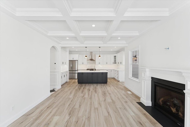 42 Second St, Extension, Glen Cove, NY 11542 - living room featuring light wood-style flooring, recessed lighting, a fireplace, beam ceiling, and coffered ceiling