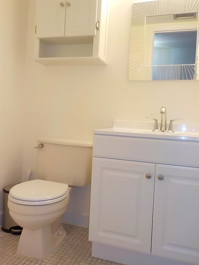 808 Woodland Ct, Coram, NY 11727 - bathroom with toilet, vanity, and tile patterned floors