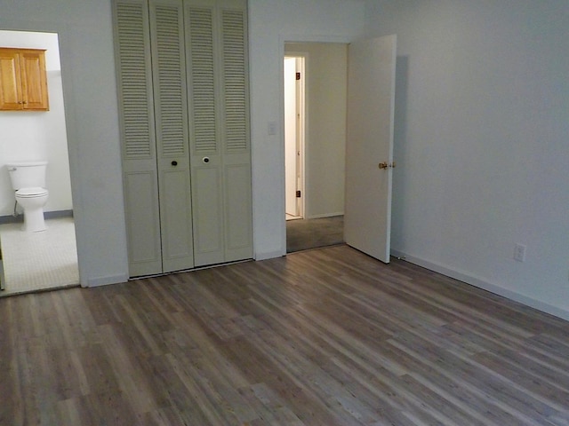 808 Woodland Ct, Coram, NY 11727 - unfurnished bedroom with wood finished floors, baseboards, a closet, and ensuite bath