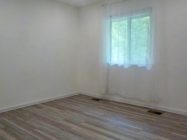 808 Woodland Ct, Coram, NY 11727 - empty room featuring wood finished floors
