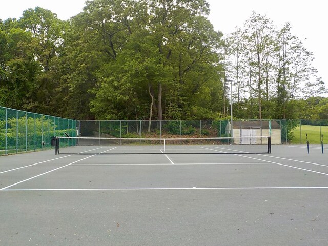 808 Woodland Ct, Coram, NY 11727 - view of tennis court with fence