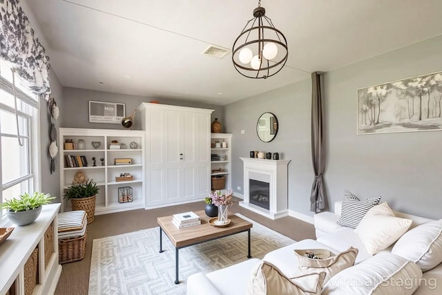 251-12 71st Rd Unit 29B, Bellerose, NY 11426 - living area featuring a glass covered fireplace, carpet, and baseboards