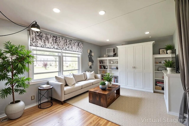 251-12 71st Rd Unit 29B, Bellerose, NY 11426 - living area with baseboards, recessed lighting, and light wood-style floors
