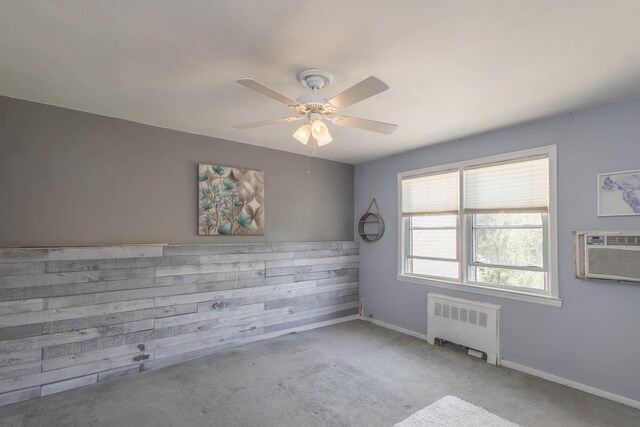 251-12 71st Rd Unit 29B, Bellerose, NY 11426 - unfurnished room with radiator heating unit, carpet floors, a ceiling fan, baseboards, and a wall mounted air conditioner