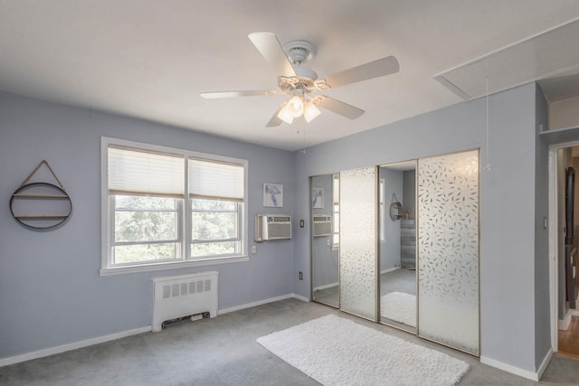 251-12 71st Rd Unit 29B, Bellerose, NY 11426 - unfurnished bedroom with radiator, attic access, carpet floors, baseboards, and an AC wall unit