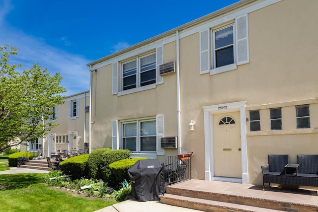 251-12 71st Rd Unit 29B, Bellerose, NY 11426 - view of property featuring stucco siding