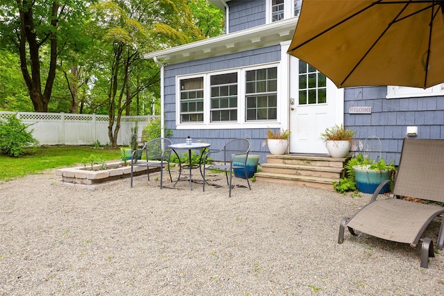 view of patio featuring fence and entry steps