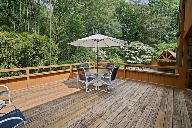 5 Ponds Ln, Purchase, NY 10577 - wooden terrace featuring outdoor dining area and view of scattered trees