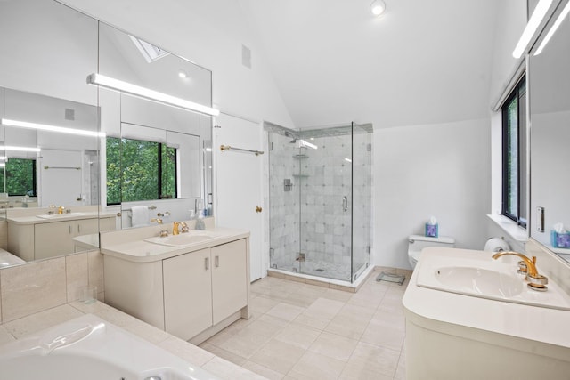 5 Ponds Ln, Purchase, NY 10577 - full bathroom with a stall shower, vaulted ceiling, two vanities, tile patterned floors, and a whirlpool tub