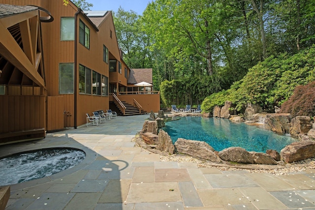 5 Ponds Ln, Purchase, NY 10577 - swimming pool featuring an in-ground hot tub, a patio, stairs, and a deck