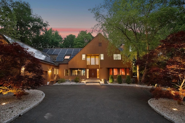 5 Ponds Ln, Purchase, NY 10577 - view of front facade featuring solar panels
