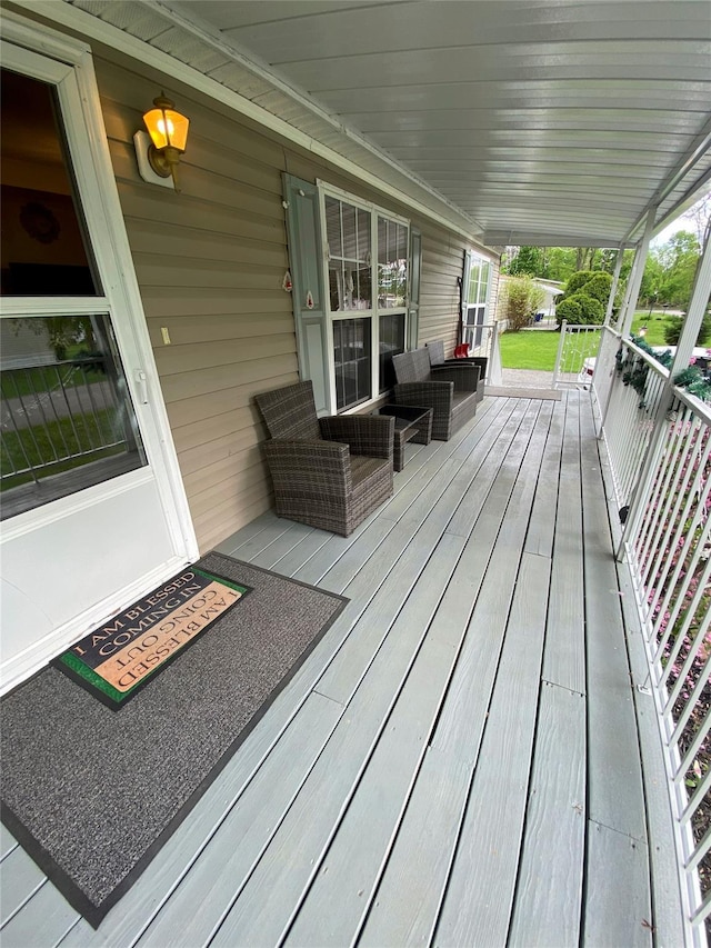 wooden terrace featuring a porch