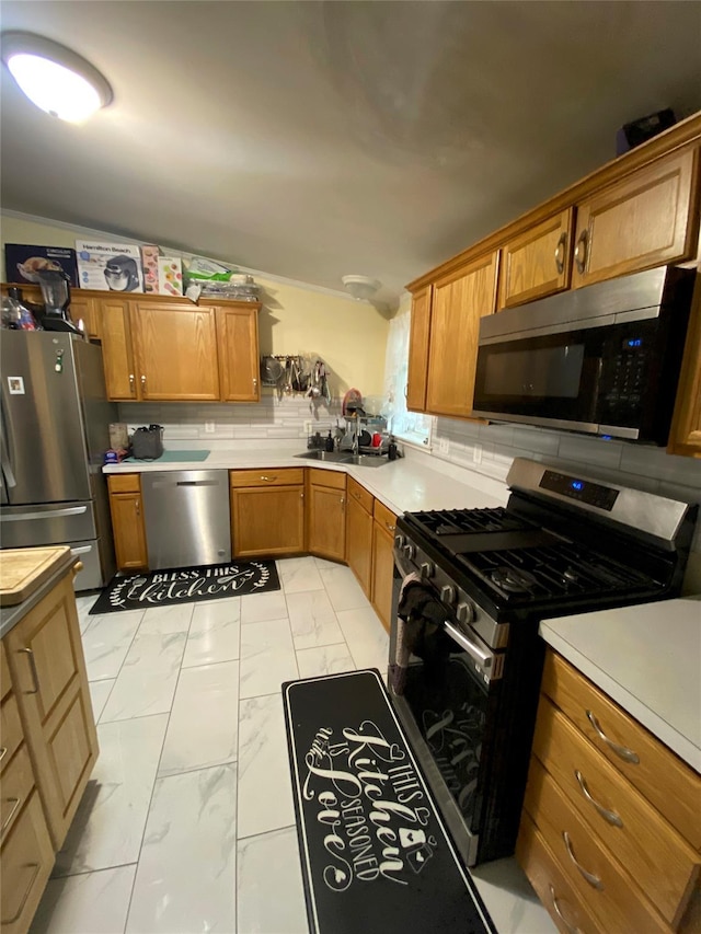 kitchen featuring stainless steel appliances, light marble finish floors, brown cabinetry, light countertops, and a sink