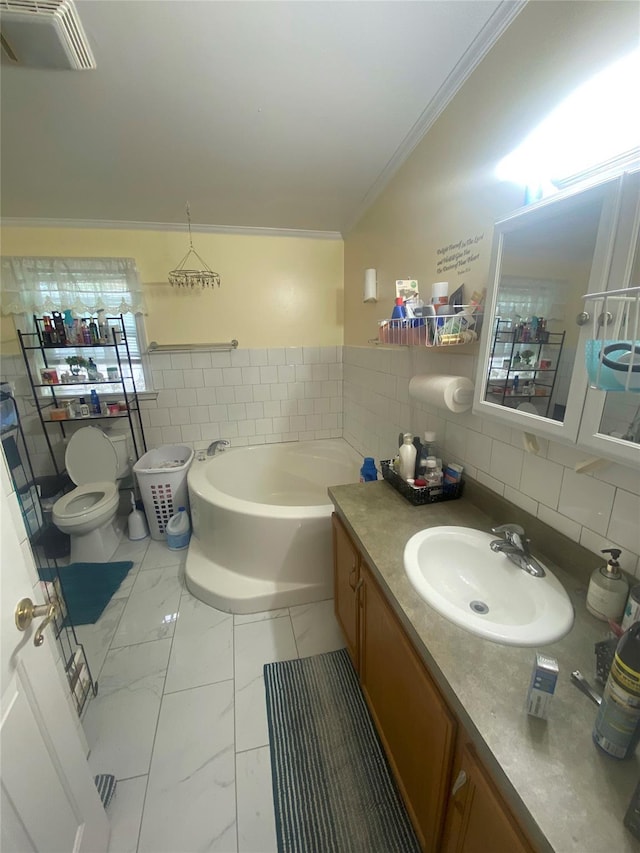 full bathroom with ornamental molding, tile walls, marble finish floors, a garden tub, and toilet