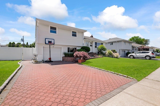 42 Macarthur Ave, Plainview, NY 11803 - tri-level home with decorative driveway and an attached garage