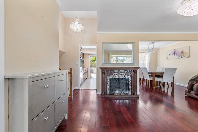 42 Macarthur Ave, Plainview, NY 11803 - living area with a chandelier, baseboards, ornamental molding, and dark wood finished floors