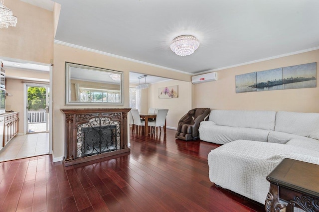 42 Macarthur Ave, Plainview, NY 11803 - living area featuring a chandelier, a wall mounted air conditioner, wood finished floors, ornamental molding, and a fireplace