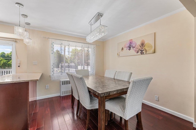 42 Macarthur Ave, Plainview, NY 11803 - dining area with radiator, a chandelier, dark wood-style flooring, baseboards, and ornamental molding
