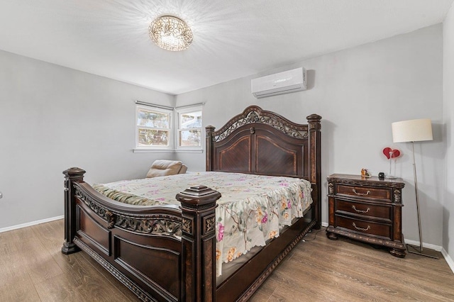 42 Macarthur Ave, Plainview, NY 11803 - bedroom featuring a wall mounted AC, wood finished floors, and baseboards