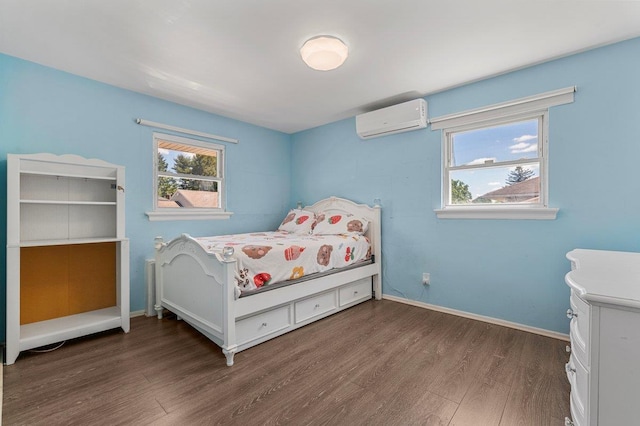 42 Macarthur Ave, Plainview, NY 11803 - bedroom with a wall unit AC, wood finished floors, multiple windows, and baseboards
