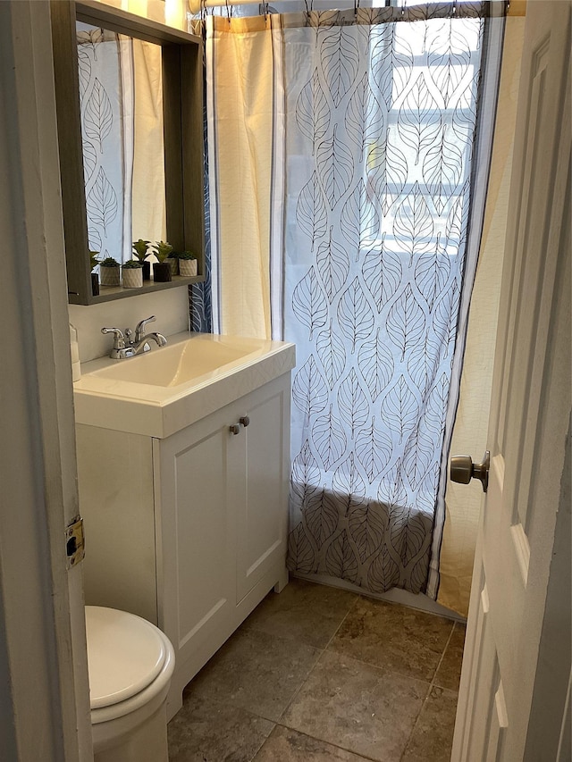 3176 Decatur Ave Unit 4F, Bronx, NY 10467 - bathroom with stone tile flooring, vanity, and toilet