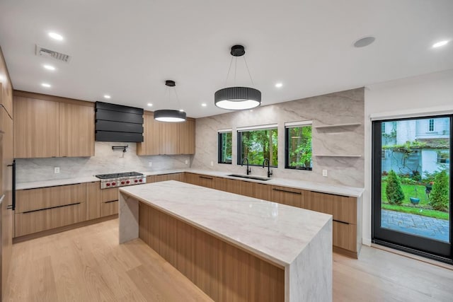 1 Bentley Rd, Great Neck, NY 11023 - kitchen with a sink, modern cabinets, light wood-style flooring, tasteful backsplash, and recessed lighting
