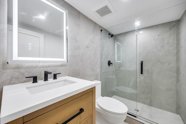 1 Bentley Rd, Great Neck, NY 11023 - full bath featuring toilet, tile walls, vanity, and a marble finish shower