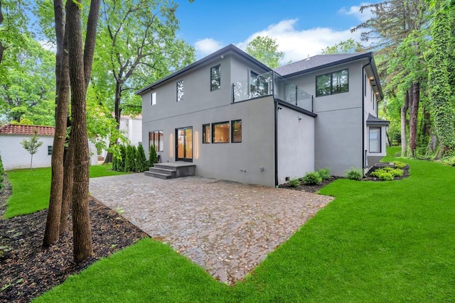 1 Bentley Rd, Great Neck, NY 11023 - back of house with stucco siding, a yard, and a patio