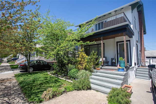 445 W Walnut St, Long Beach, NY 11561 - townhome / multi-family property with covered porch and stucco siding