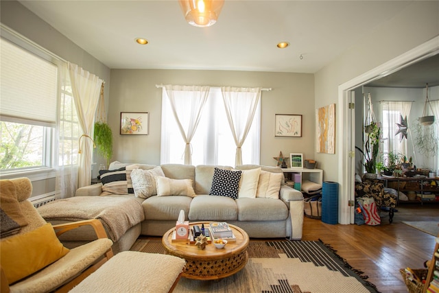 445 W Walnut St, Long Beach, NY 11561 - living area featuring wood finished floors, recessed lighting, and a baseboard radiator