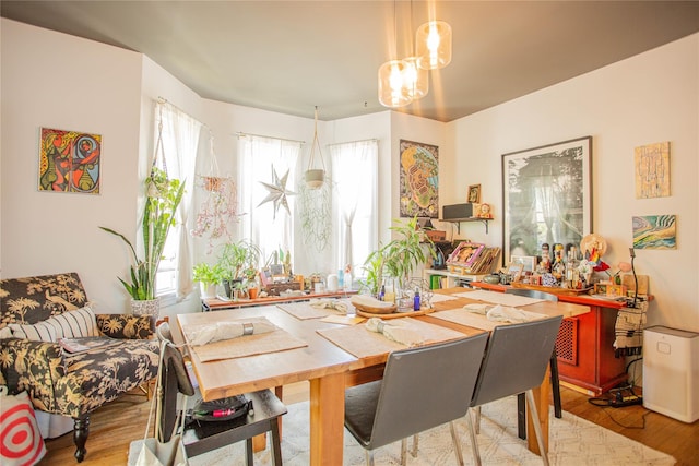 445 W Walnut St, Long Beach, NY 11561 - dining room featuring wood finished floors and a chandelier