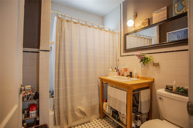 445 W Walnut St, Long Beach, NY 11561 - full bathroom with tile walls, toilet, vanity, and shower / tub combo