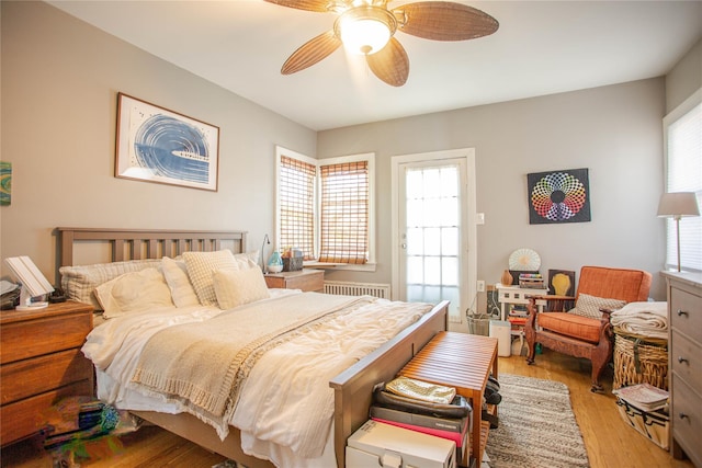 445 W Walnut St, Long Beach, NY 11561 - bedroom featuring light wood-style floors, a ceiling fan, and radiator heating unit