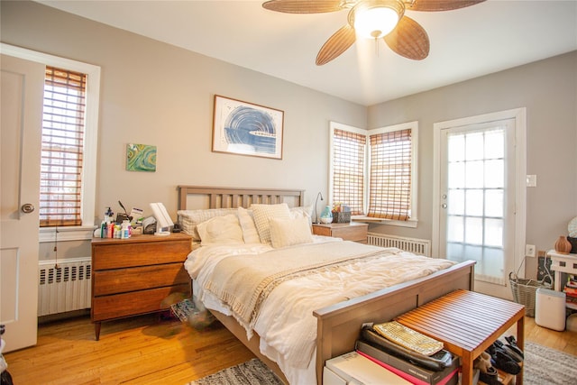 445 W Walnut St, Long Beach, NY 11561 - bedroom featuring radiator, light wood-style floors, and ceiling fan