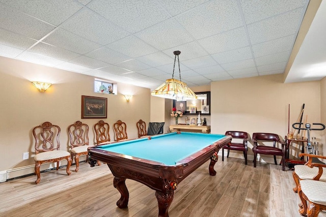 game room with wood finished floors, a drop ceiling, billiards table, and baseboard heating