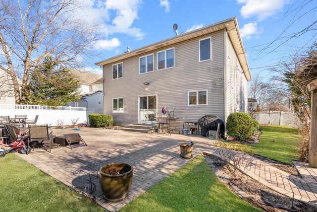 rear view of house featuring a patio area and outdoor dining area